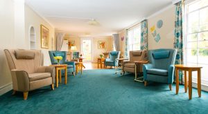 Bright blue and white living room at Orford House