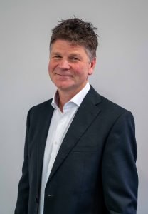 Image of Chris Poole, new CEO of Greensleeves, smiling.